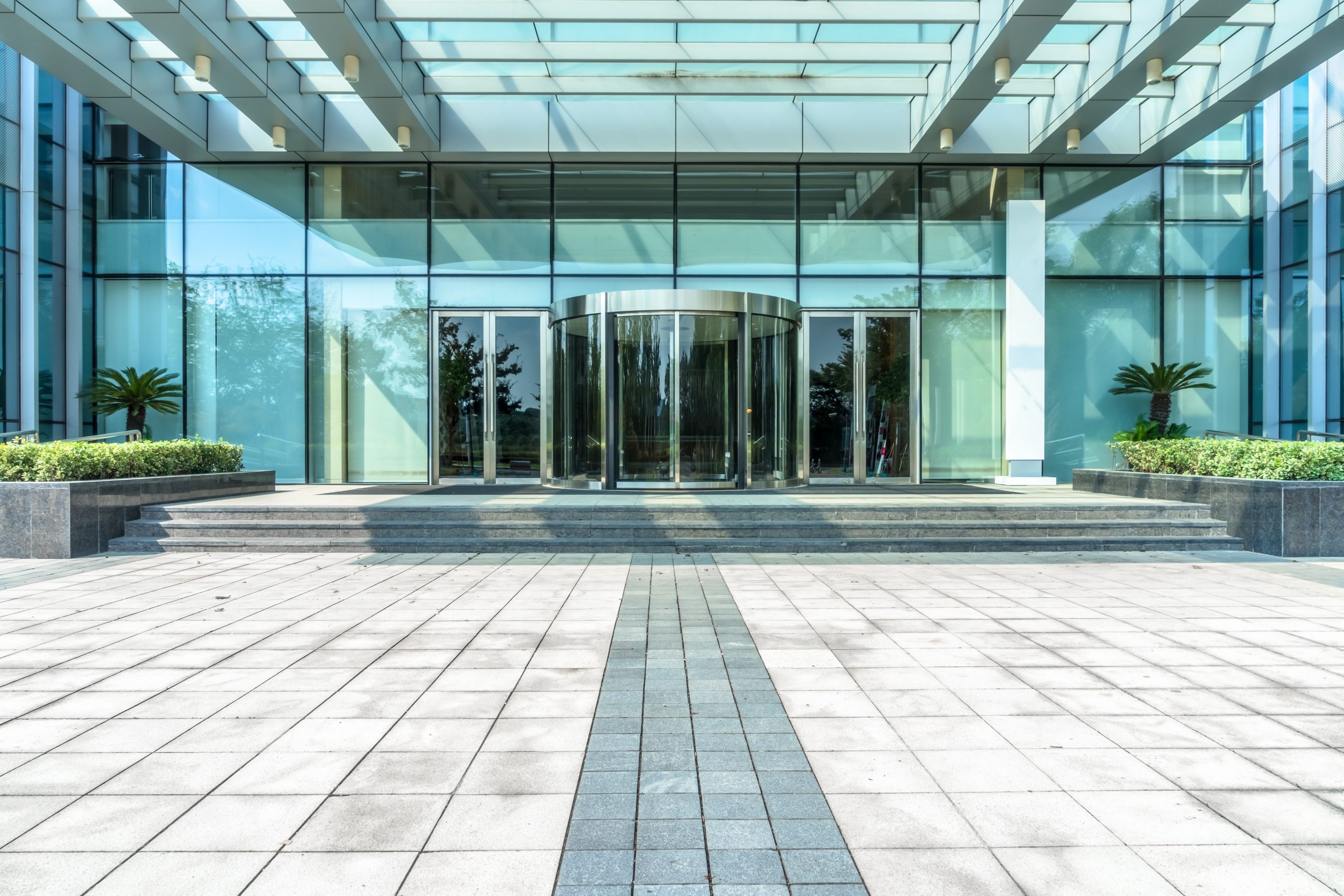 empty pavement front of the modern office entrance